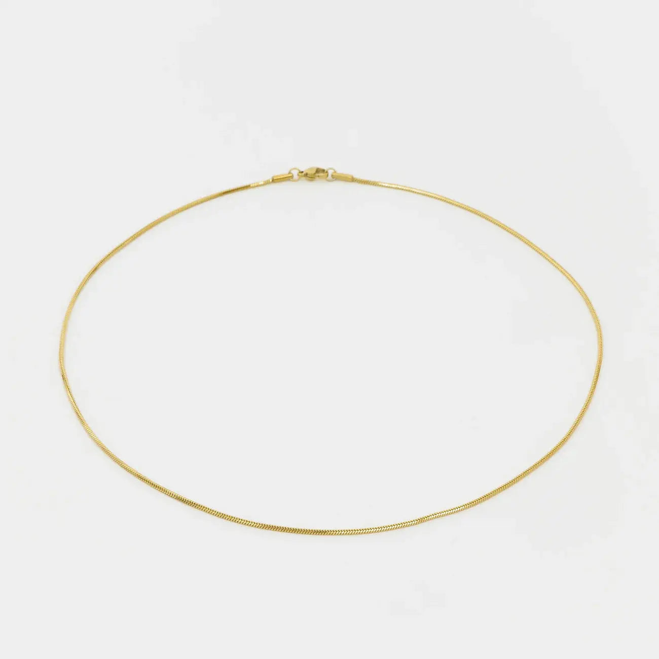 Gold necklace on a white background