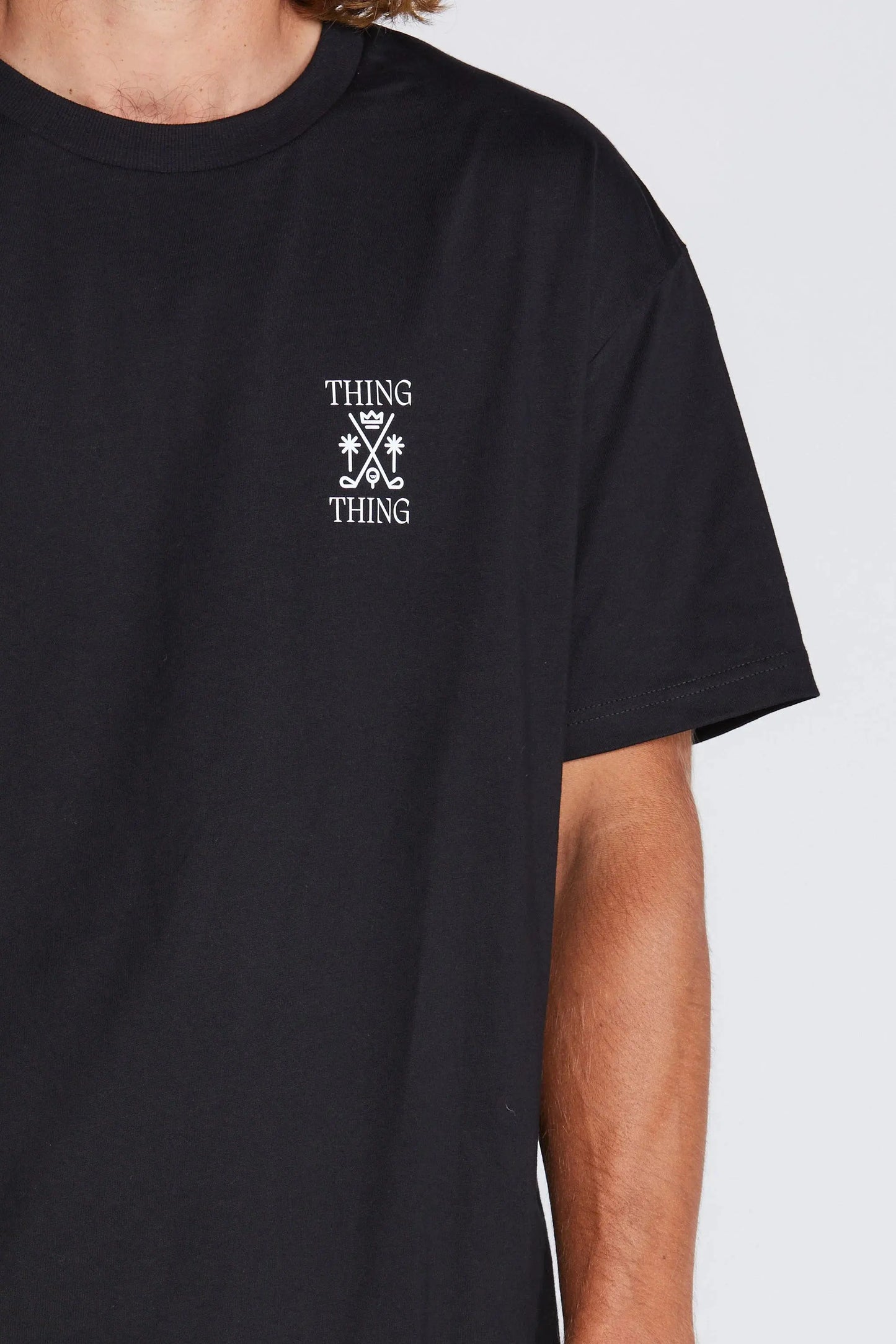Black t-shirt with white logo and text on a plain background