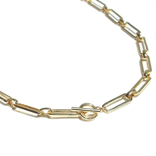 Gold chain bracelet on a white background