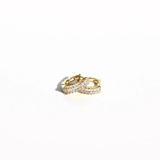 Gold hoop earrings on a white background