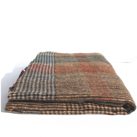 Folded plaid fabric on a white background. Throw Scarf Tweed - The Rose Edit