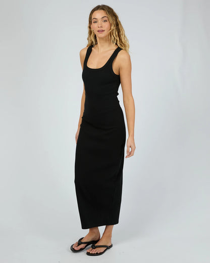 Woman wearing a black sleeveless dress on a white background