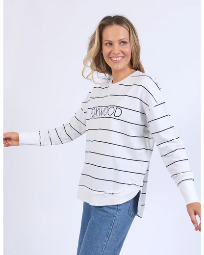 Woman wearing a striped hoodie with 'Oakwood' text on a white background