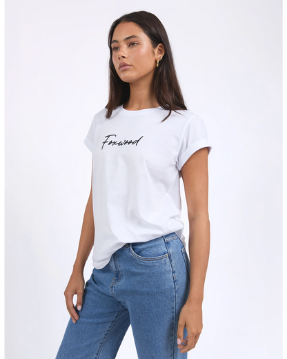 Woman wearing a white t-shirt with 'Forwood' text and blue jeans on a light gray background