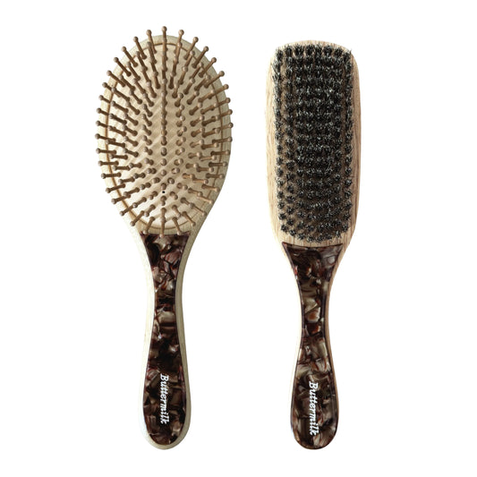 Two hairbrushes with tortoiseshell handles on a white background. Buttermilk The Toasted Prep Set - The Rose Edit