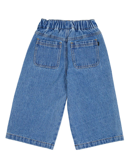 Blue denim pants on a white background. Animal Crackers Era Jean Mid Blue - The Rose Edit