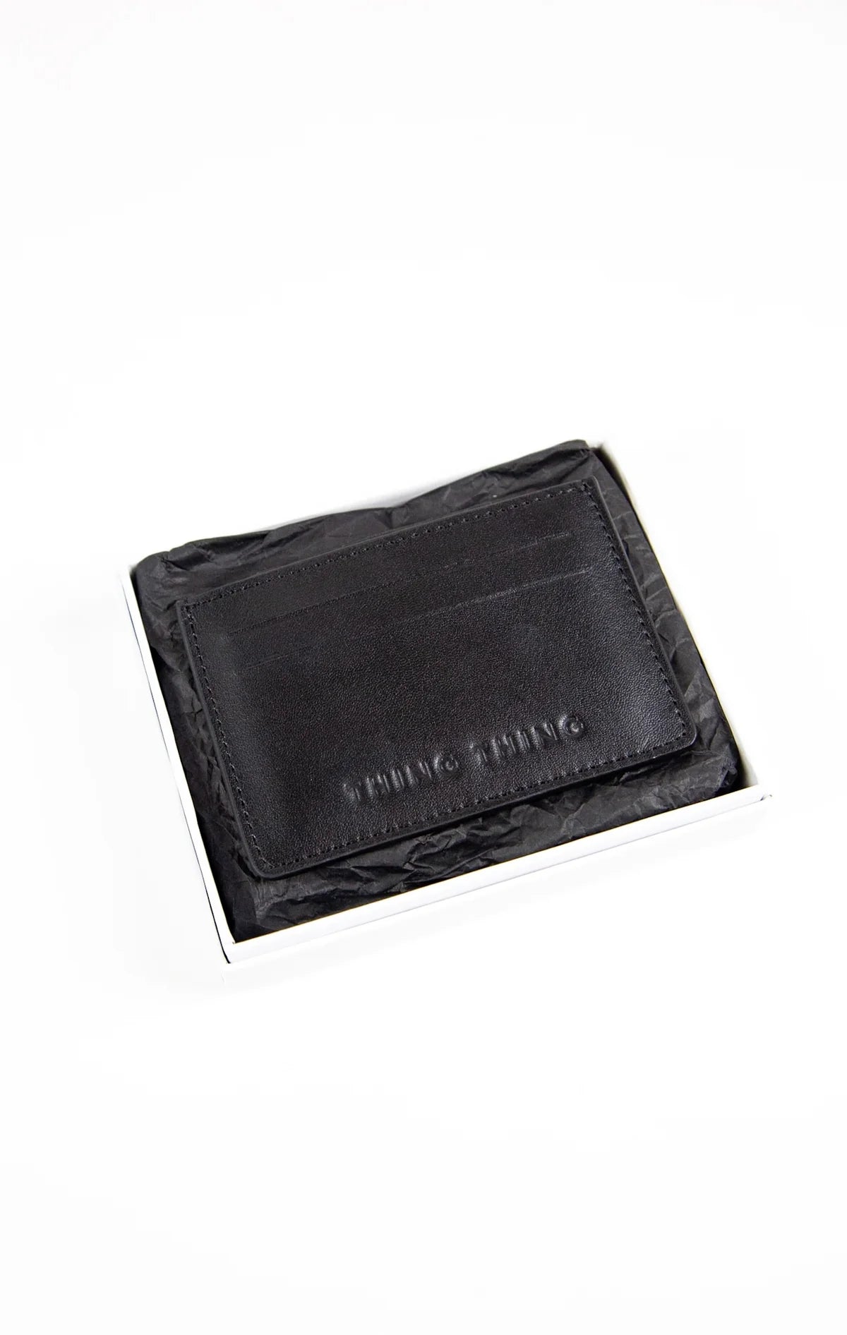 Black leather wallet with brand name on a white background