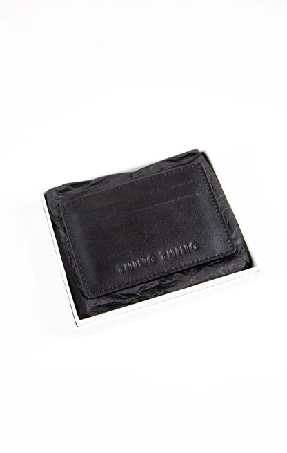 Black leather wallet with brand name on a white background