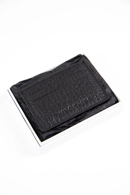 Black textured wallet on a white background