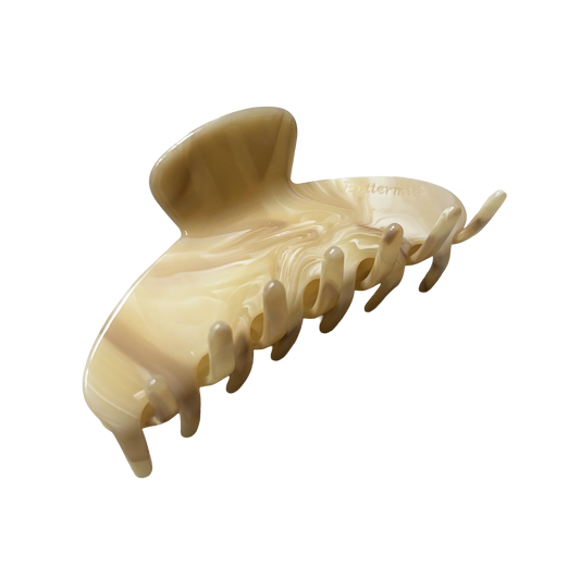 Beige hair clip on a white background. Buttermilk Elle Claw Clip Buttercream - The Rose Edit