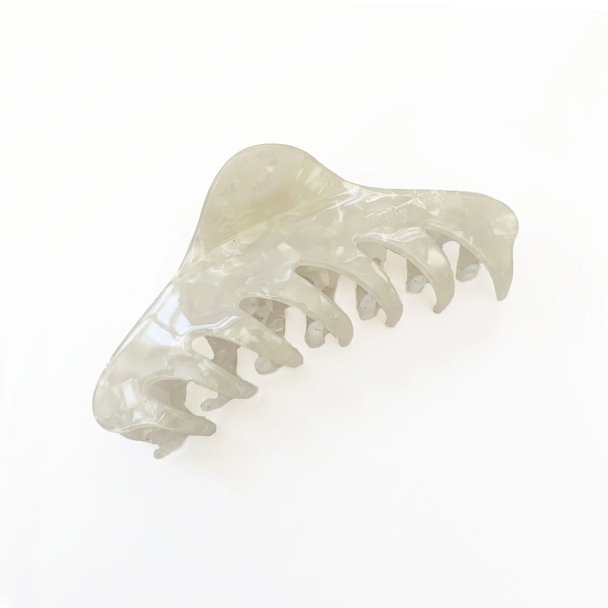 White hair clip on a white background. Buttermilk Georgia Claw Clip Classic Pearl - The Rose Edit