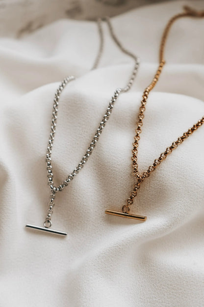 Two necklaces with clasp ends on a soft fabric background. Large T Bar Necklace KatyB Jewellery