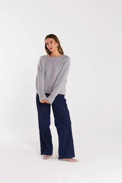 Woman wearing a gray sweater and navy pants on a white background. Lilo Jumper Fog - The Rose Edit