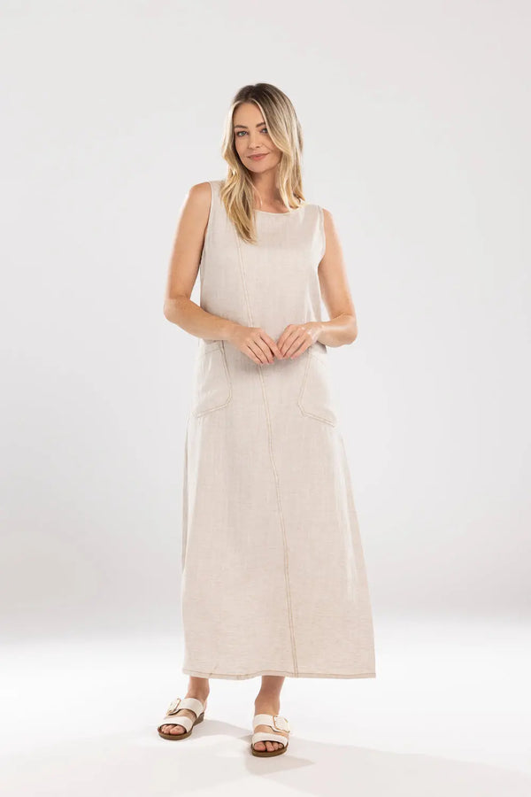 Woman wearing a beige sleeveless dress on a white background