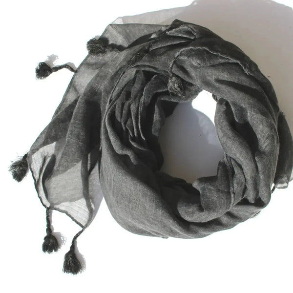 Gray scarf with tassels on a white background