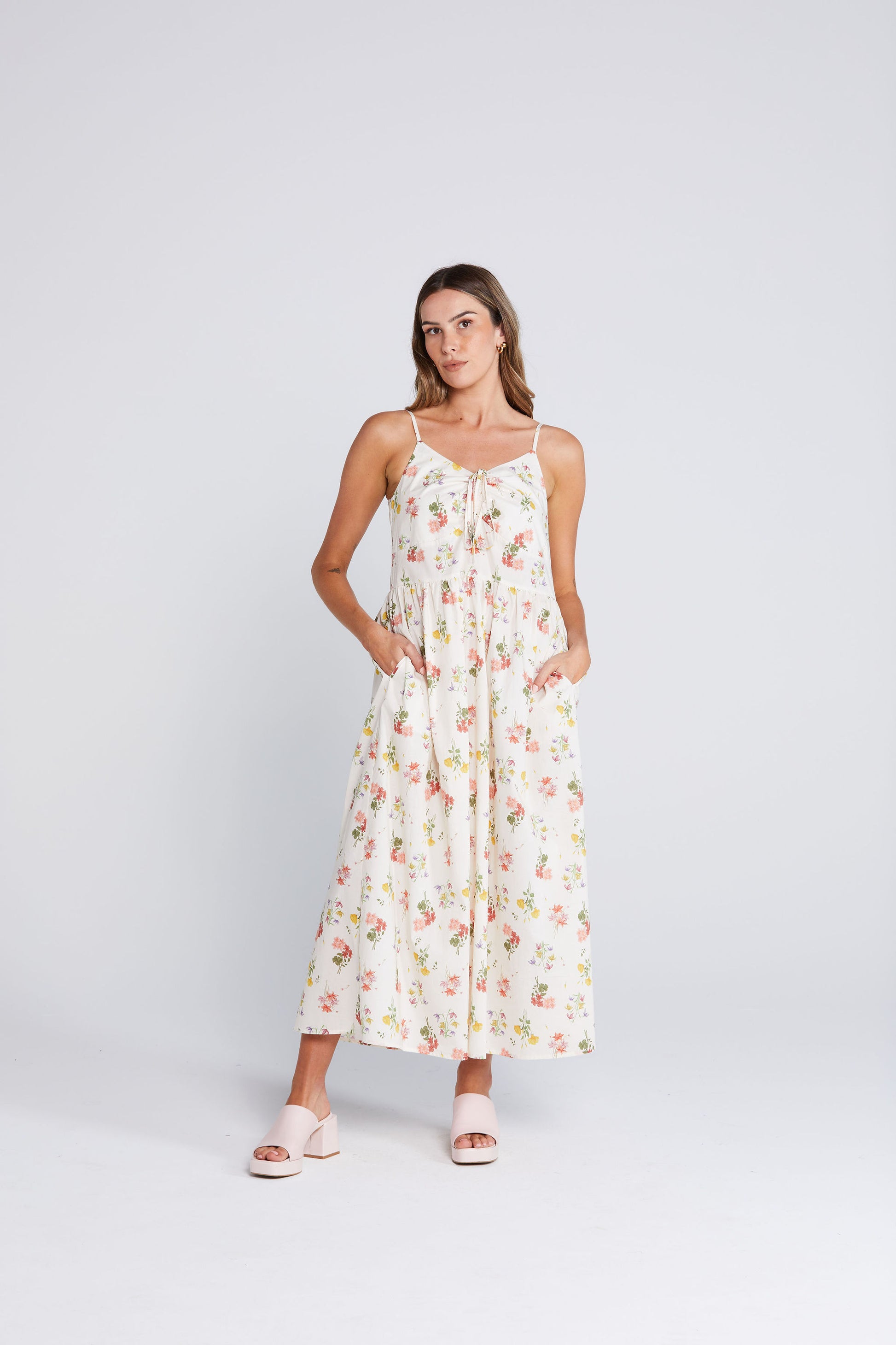 Woman wearing a floral dress on a white background