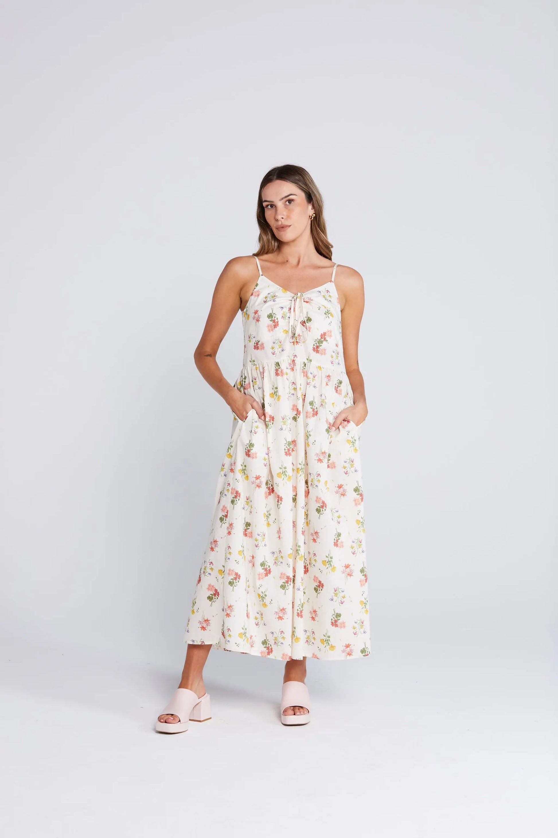 Woman wearing a floral dress on a white background