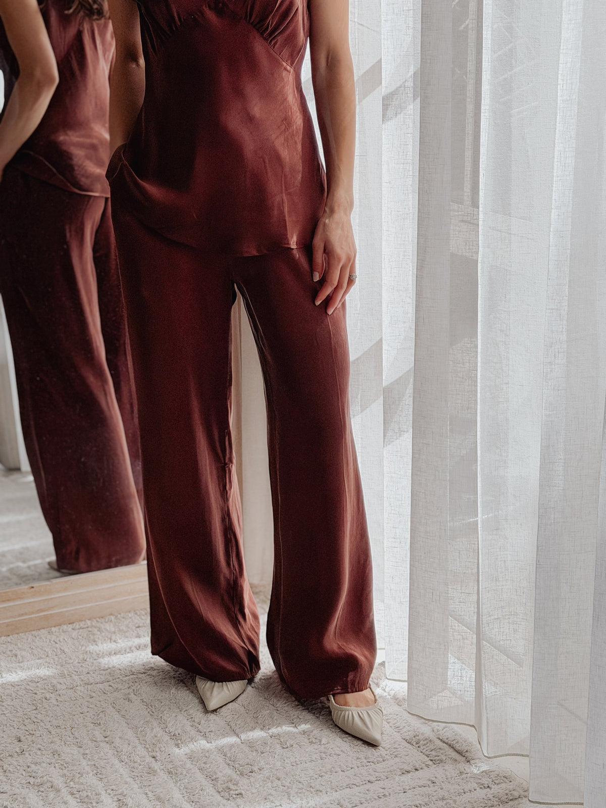 Mona Pant in Chocolate, side view showing the fluid drape