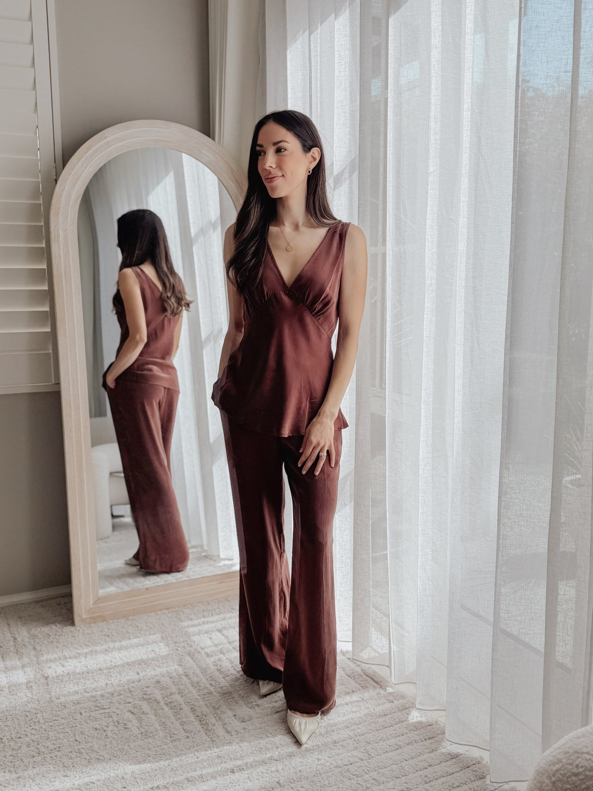 Mona Set in Chocolate, full length in front of an arched mirror