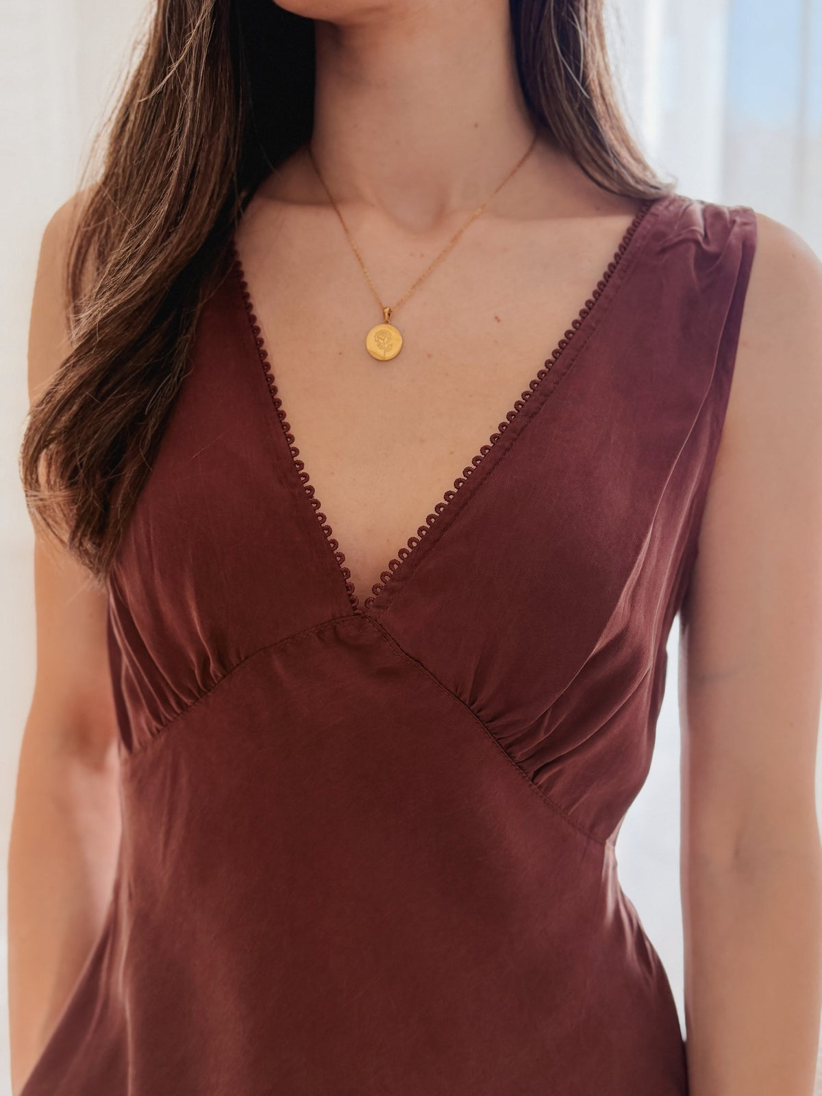 Close up of the Mona Top V neckline in silky Chocolate cupro