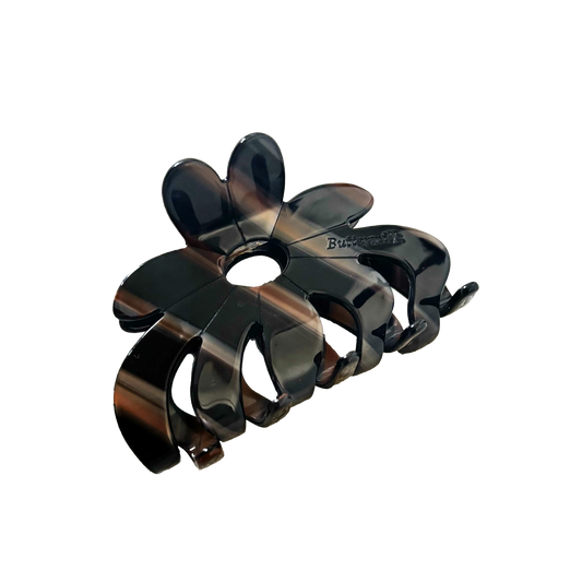 Black hair clip on a white background.Buttermilk Rebekah Claw Clip Coffee Table - The Rose Edit